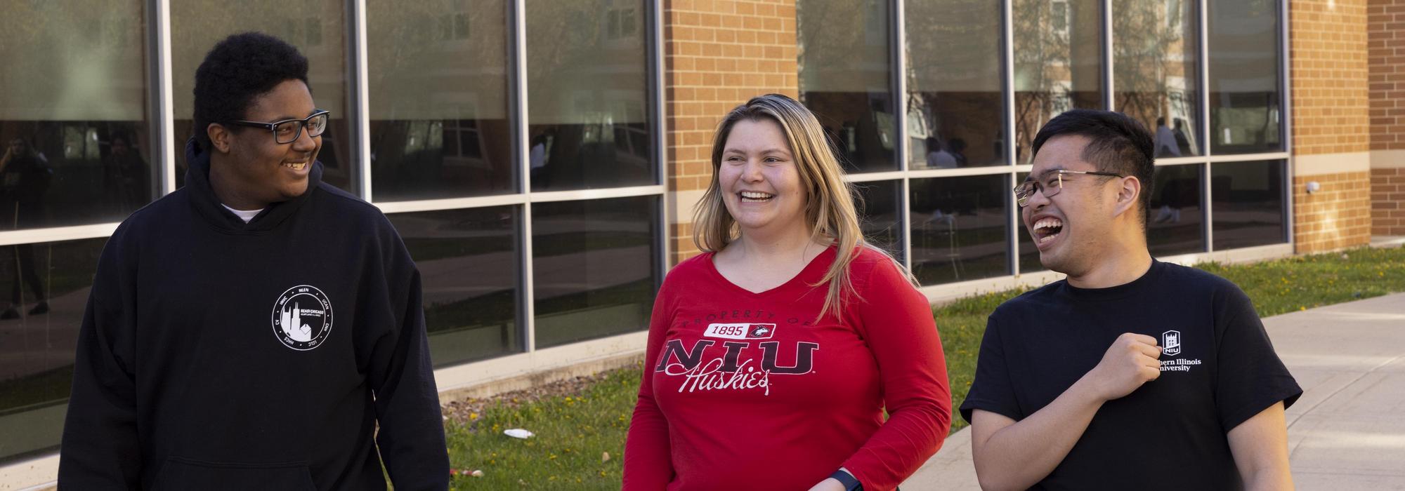 Student teacher smiles to young students